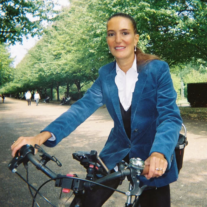 A photograph of Pilar Corrias on her bike in Regent's Park, London