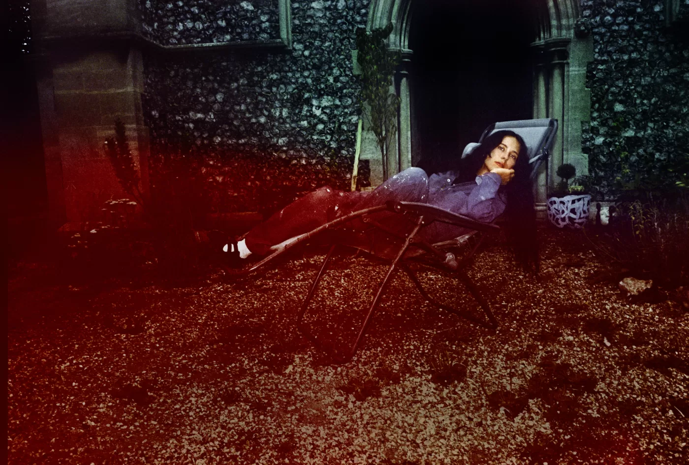 A photograph of Harley Weir sat outside her converted church in Faversham