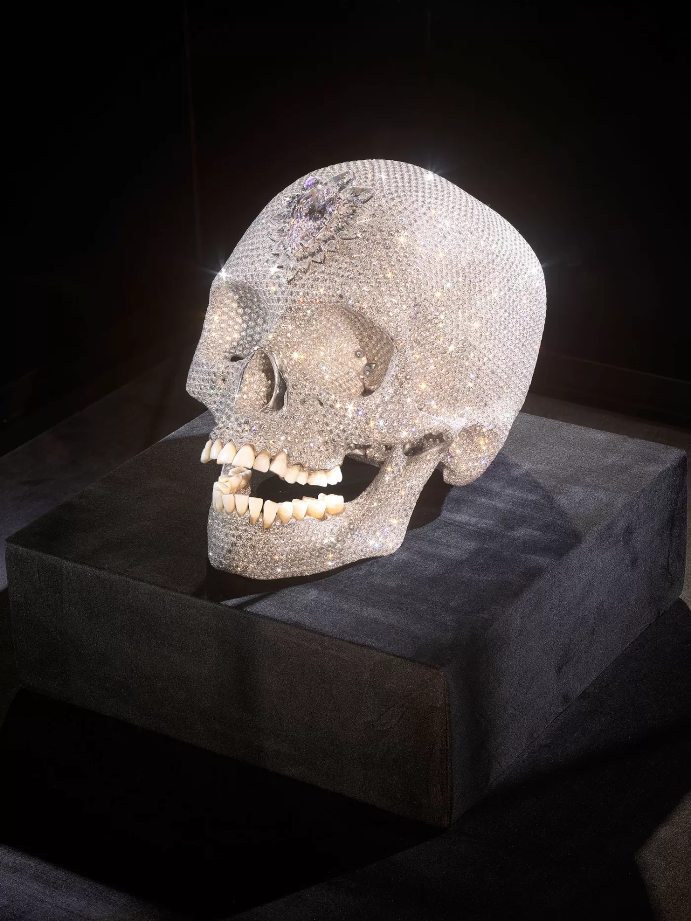 Installation view of Damien Hirst's bejewelled skull in ‘The Weight of Things’ at Munich’s Museum for Urban and Contemporary Art