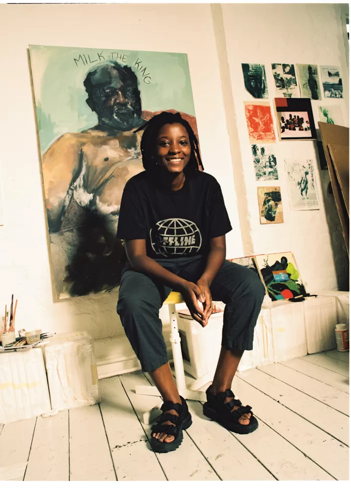 A photograph of Kudzanai-Violet Hwami sat in her studio