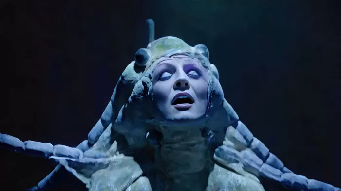 A video still of a woman in a mythical creature costume for Marianna Simnett's 'GORGON', 2023