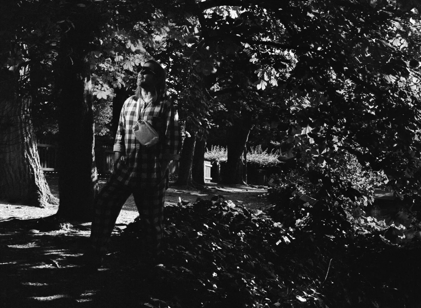 A black and white photograph of Mark Leckey at Alexandra Palace Park, London