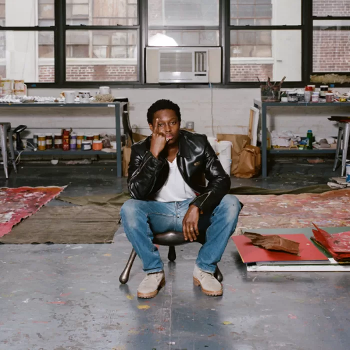 A photograph of Reginald Sylvester II inside his studio