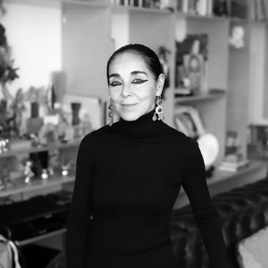 A black and white photograph of Shirin Neshat in her Brooklyn studio