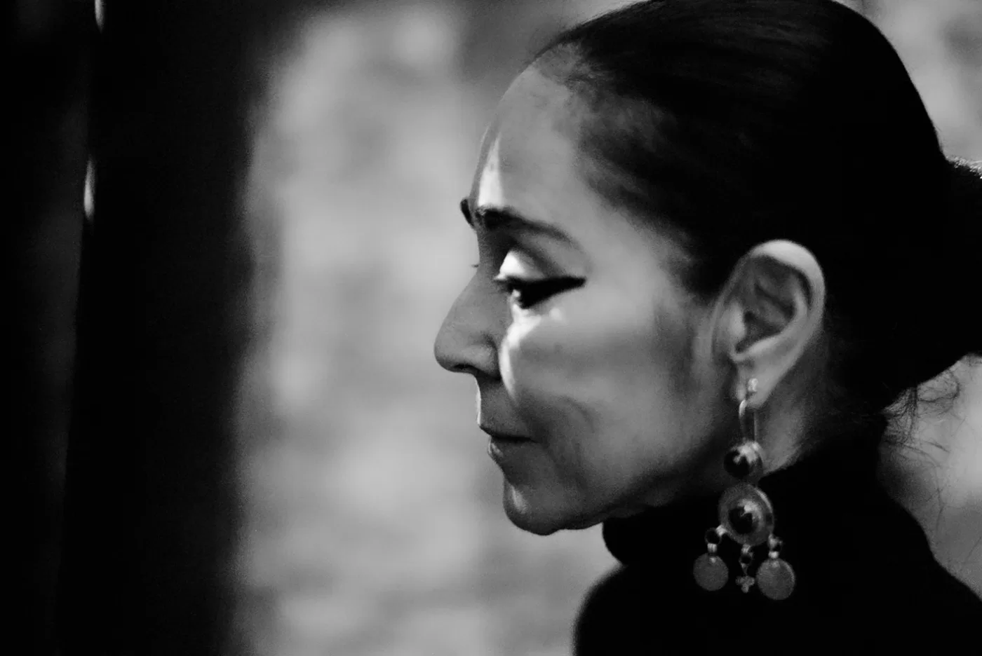 A black and white close-up portrait of Shirin Neshat