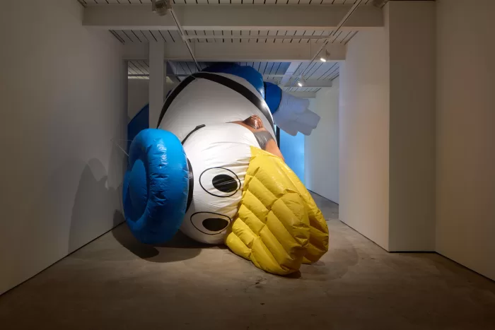 Installation view of an inflatable Donald Duck in Simeon Barclay's 'At Home, Everywhere and Nowhere' exhibition at Gathering, London