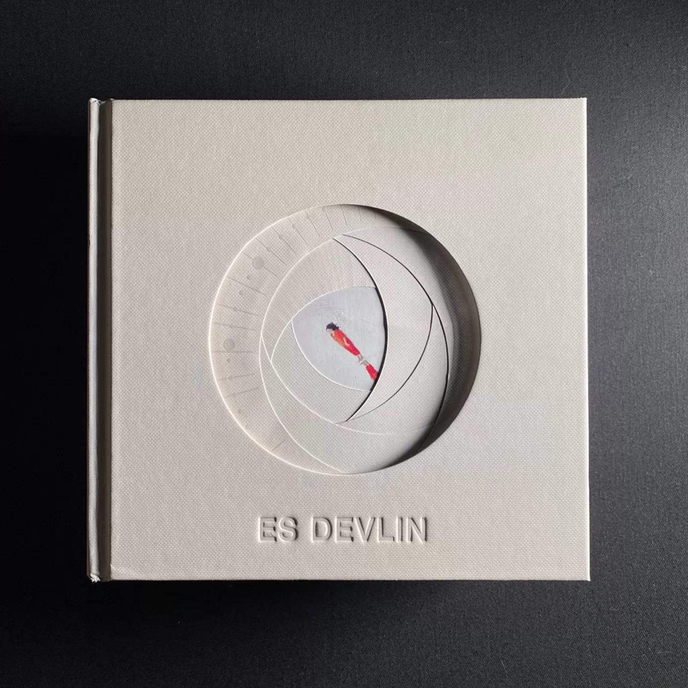 A photograph of the cover of the book 'An Atlas of Es Devlin'