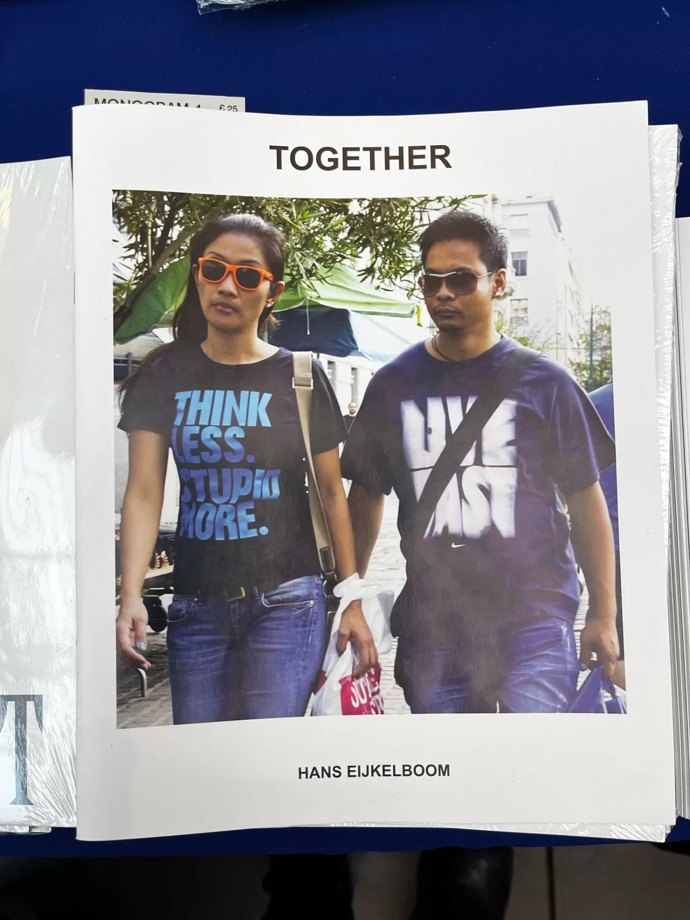 A photograph of the cover of Hans Eijkelboom's 'Together', featuring a candid photograph of a couple walking together