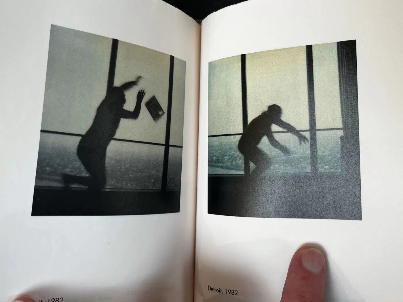 A photograph of a double-page spread from a photography book picturing someone jumping in the air