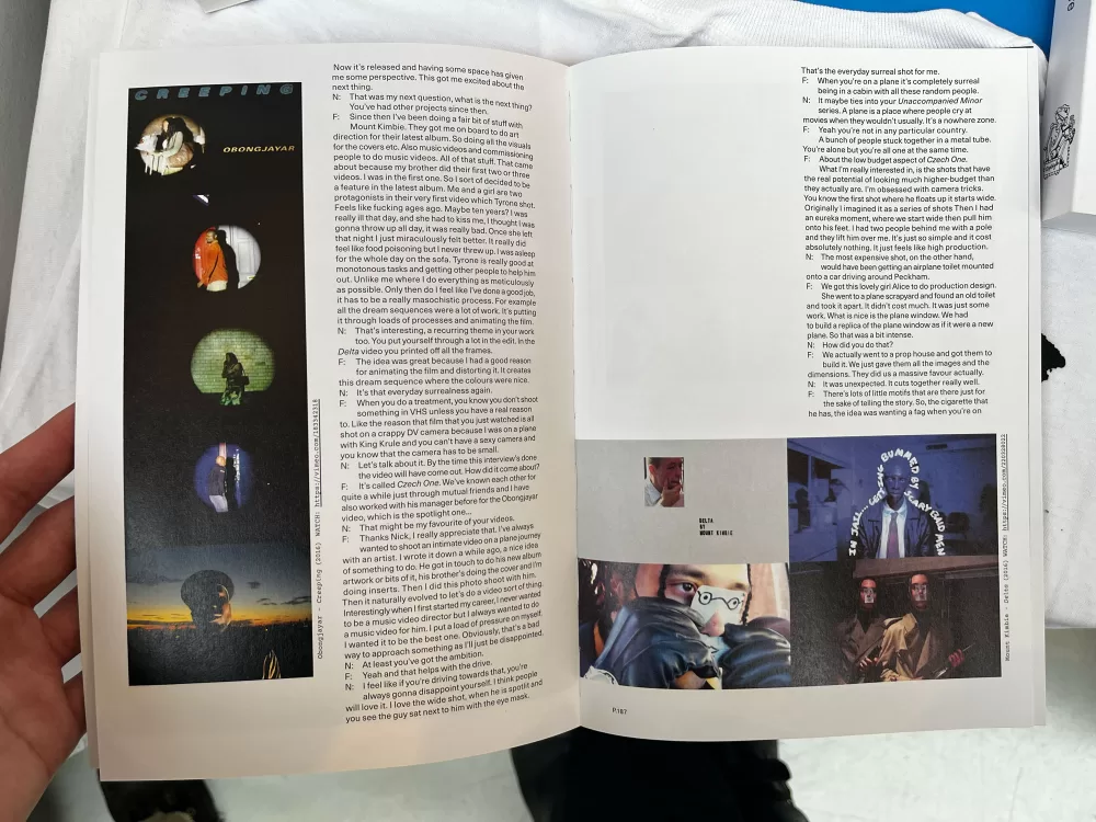 A photograph of a double-page spread from TOPSAFE's 'Next To Nothing', featuring a large body of text