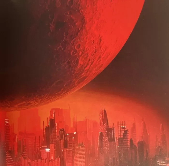 A red-hued sci-fi image of a large planet looming over a cityscape