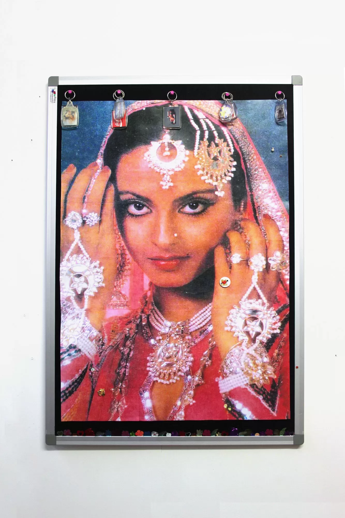 A photograph of a kitsch Y2K style moodboard of a portrait of a woman in traditional Indian dress, overlayed with stickers and trinkets