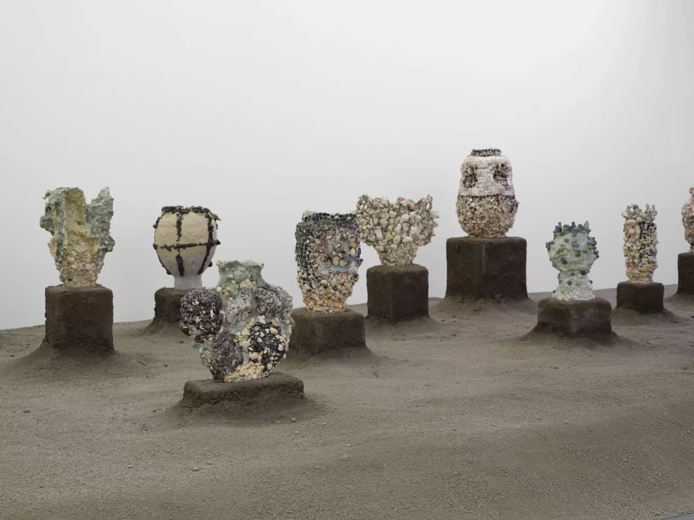 An installation view of a series of tiled ceramic sculptures