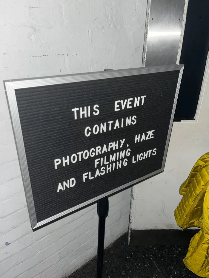 A photograph of a sign warning about photography, filming and flashing lights at the EPOCH magazine launch at the ICA in London