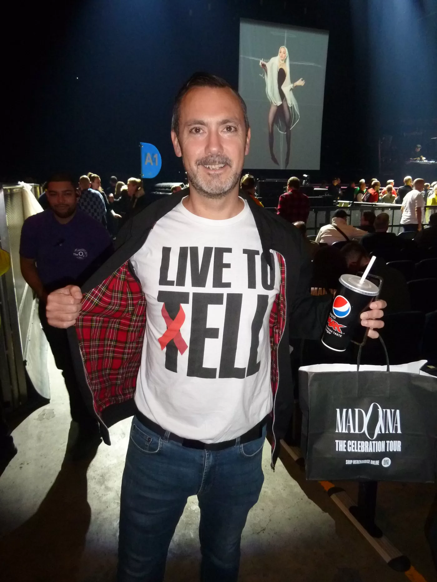 Crowd member photographed wearing a 'Live to Tell' T-shirt at Madonna's 2023 Celebration Tour