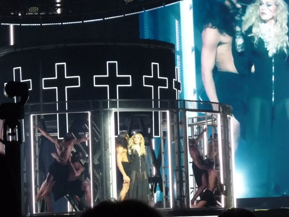 Madonna photographed on stage with dancers