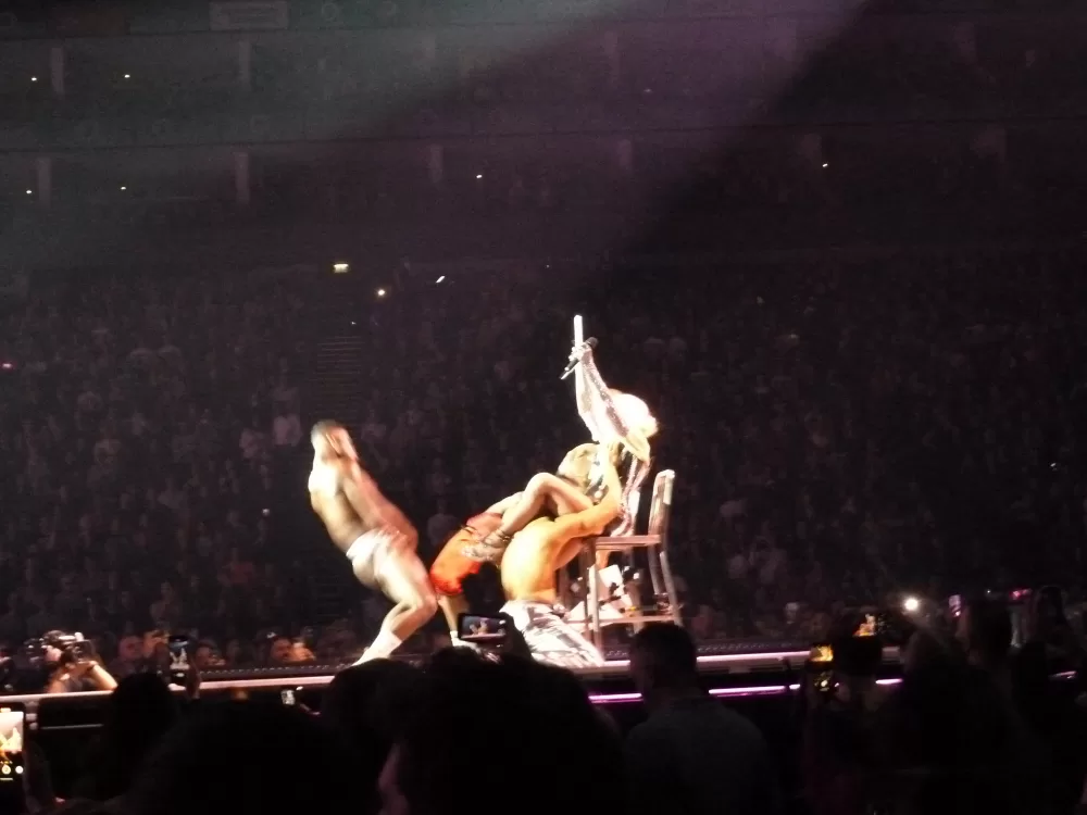 Madonna photographed on stage with dancers