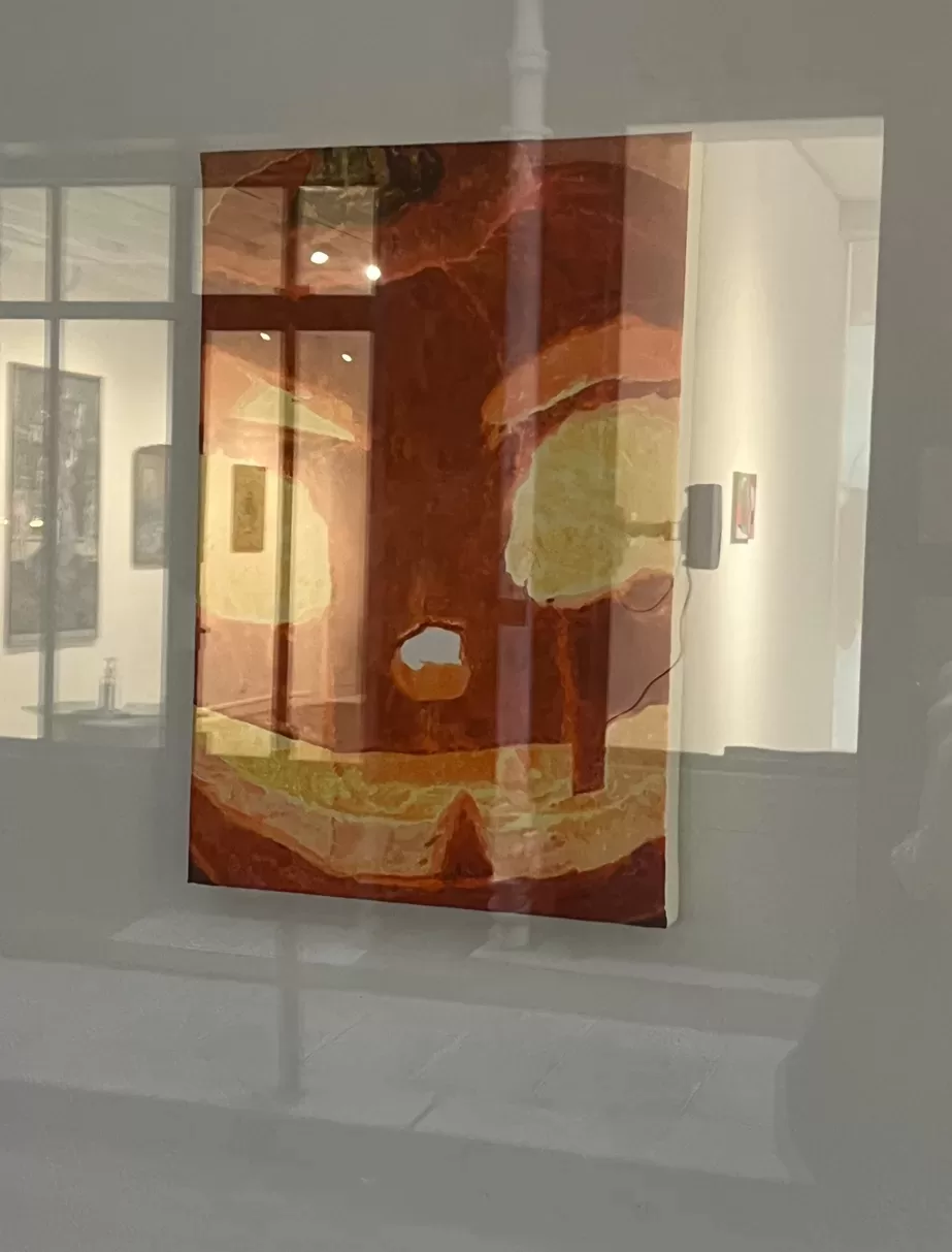 Photograph of an artwork by Xuteng Chén taken through a gallery window