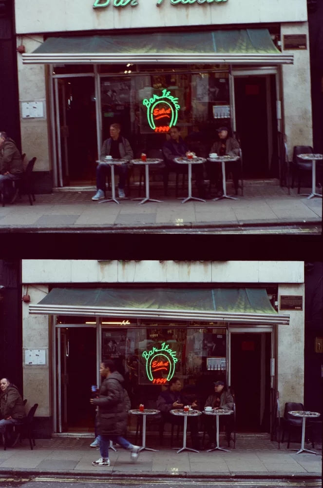 Joshua Leon and Abbas Zahedi sit outside Bar Italia, in conversation over drinks