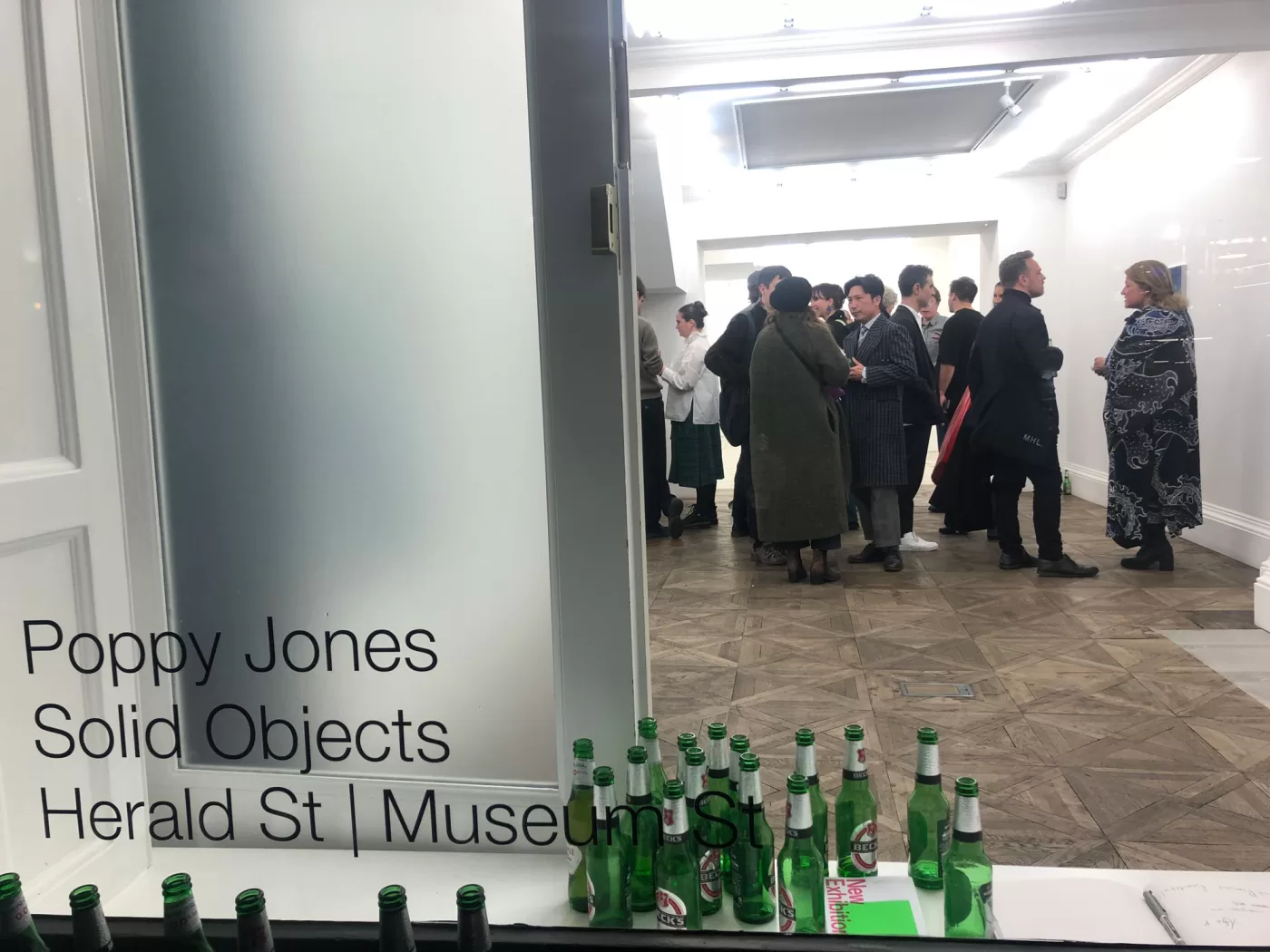 The last photo on Poppy Jones' camera roll: the opening party of her exhibition 'Solid Objects' at Herald St, London