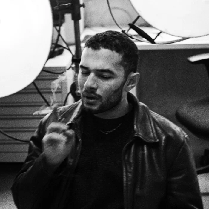 Rafik Greiss in his studio smoking a cigarette.