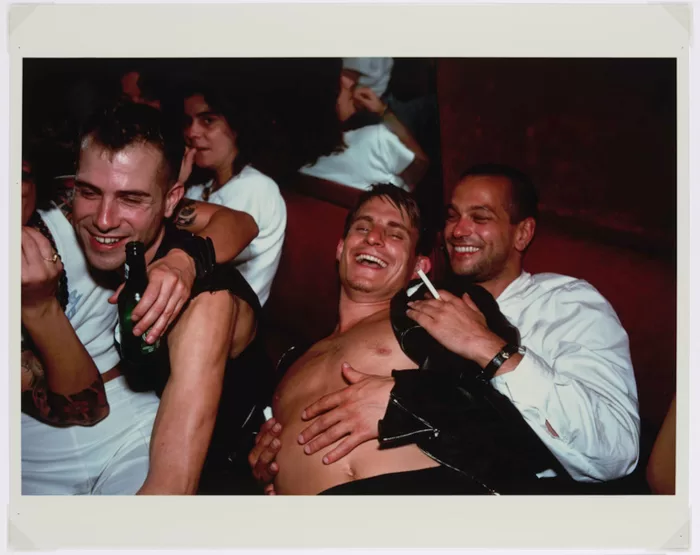 Nan Goldin, Clemens, Jens and Nicolas Laughing at Le Pulp, Paris, 1999 © Nan Goldin. Courtesy of Nan Goldin and Gagosian