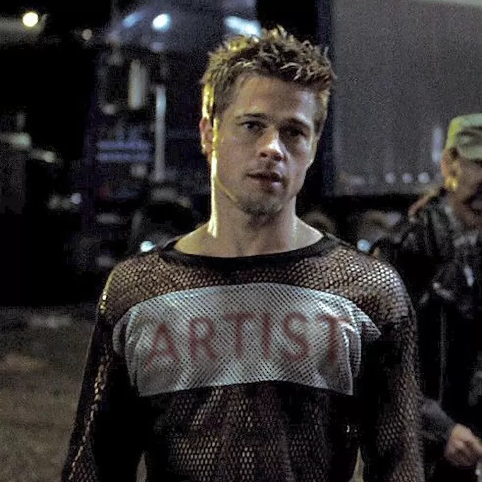 Brad Pitt in Fight Club by David Fincher, wearing his 'Hustler' shirt photoshopped to say 'Artist' across the chest