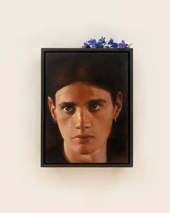 Ki Yoong's oil on wood panel painting of a man's face, framed and adorned with blue flowers