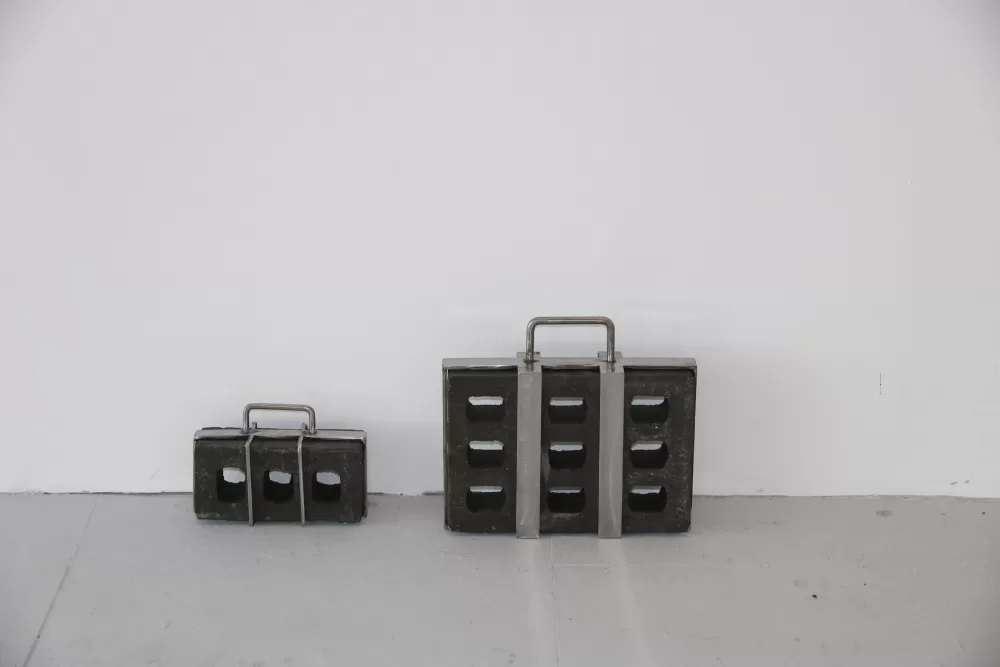 Katie Shannon's steel brick briefcase sculptures