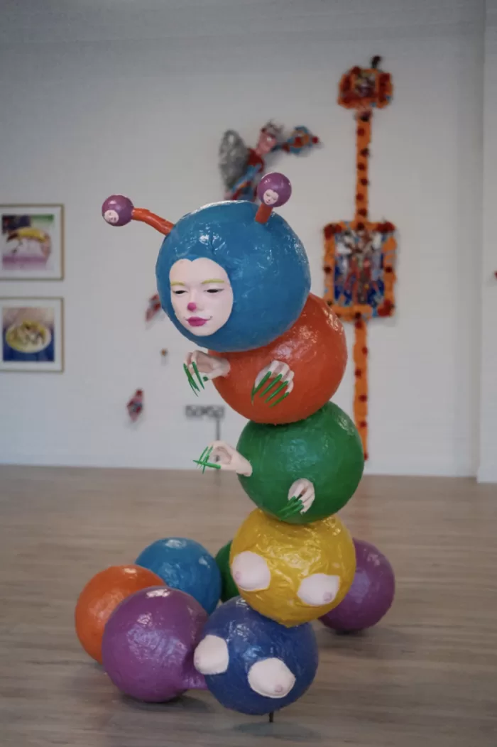 Claudia Martignetti's colourful sculpture of a human-caterpillar hybrid